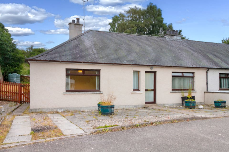 Front of the bungalow from the paved approach