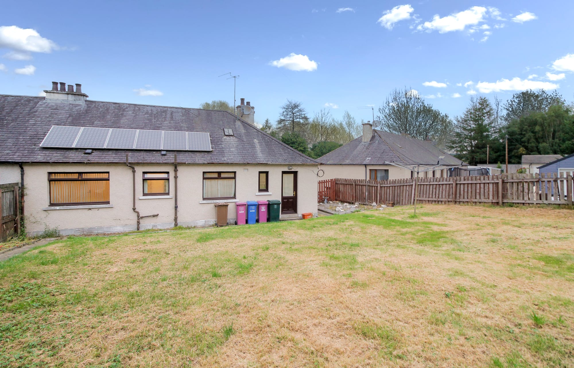 Rear garden, lawn and solar panels