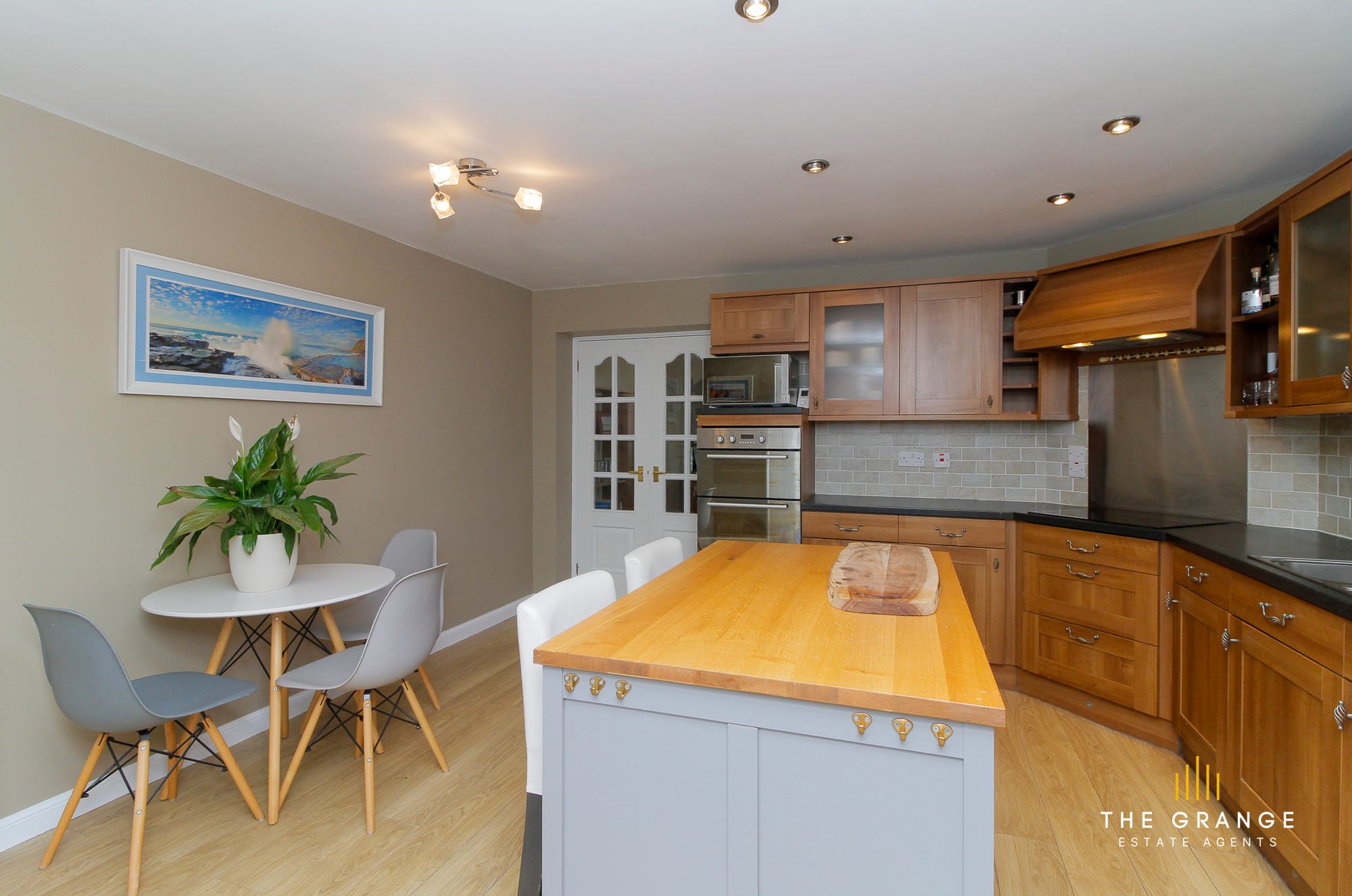 Kitchen and dining area, with island and French doors