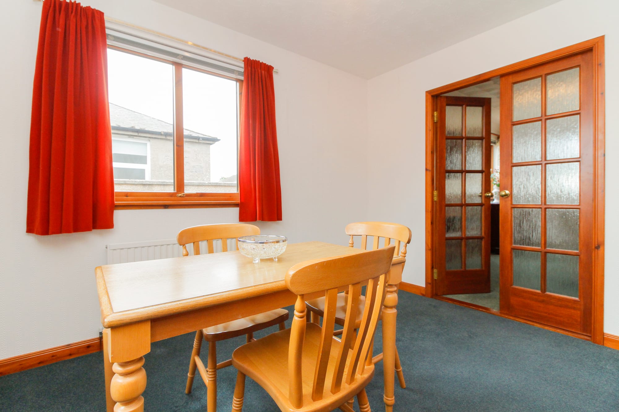 Dining room with double doors to the living room