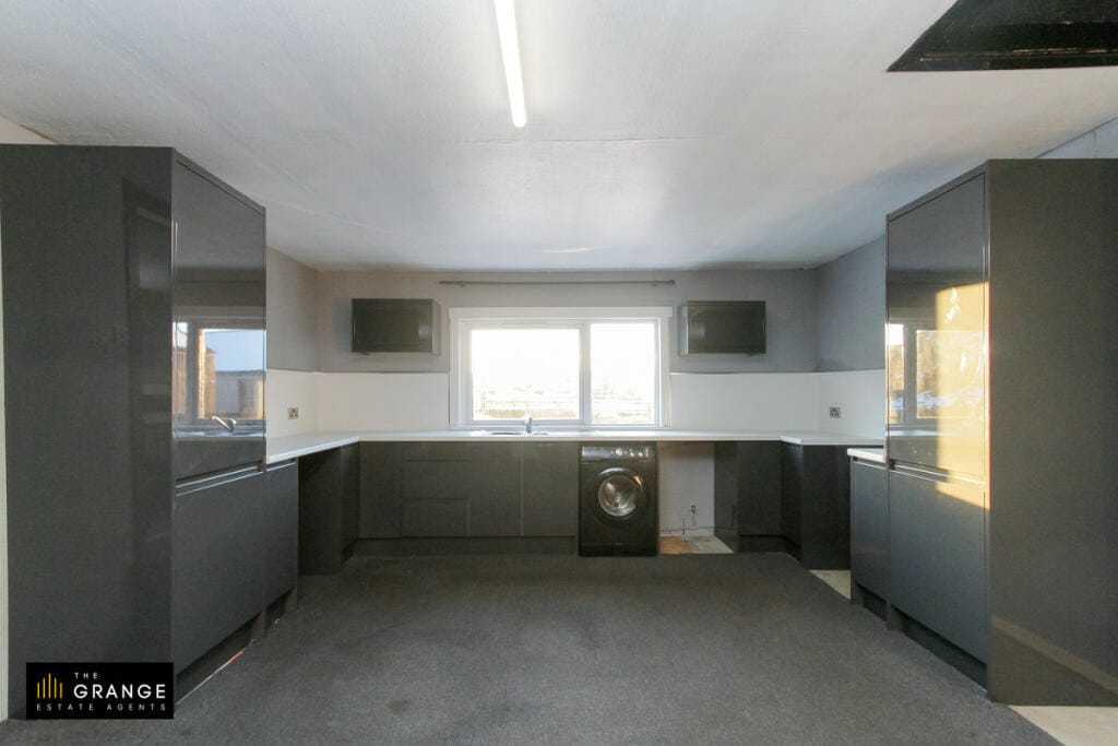 The kitchen, looking across both worktop runs