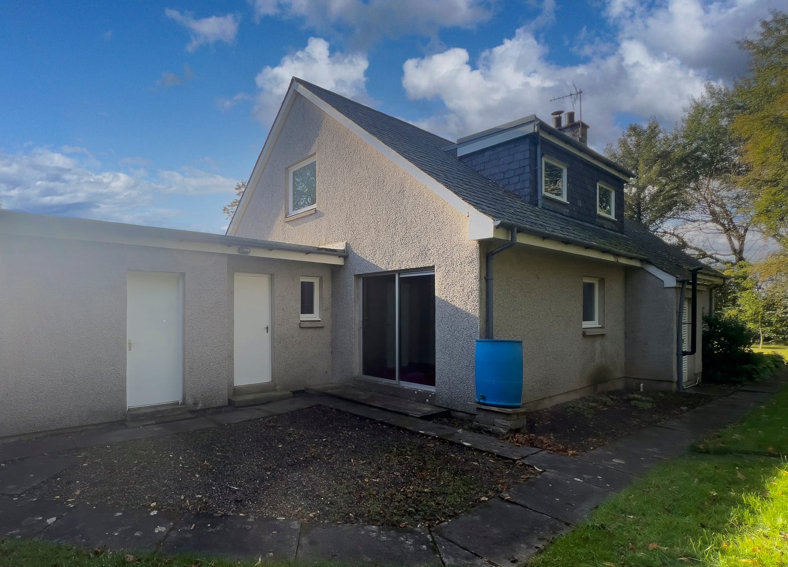 The rear of the house and the garage
