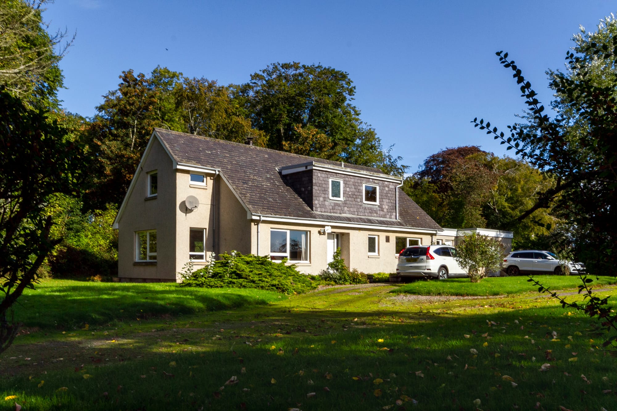 The house from the lawn, with the garage to the right