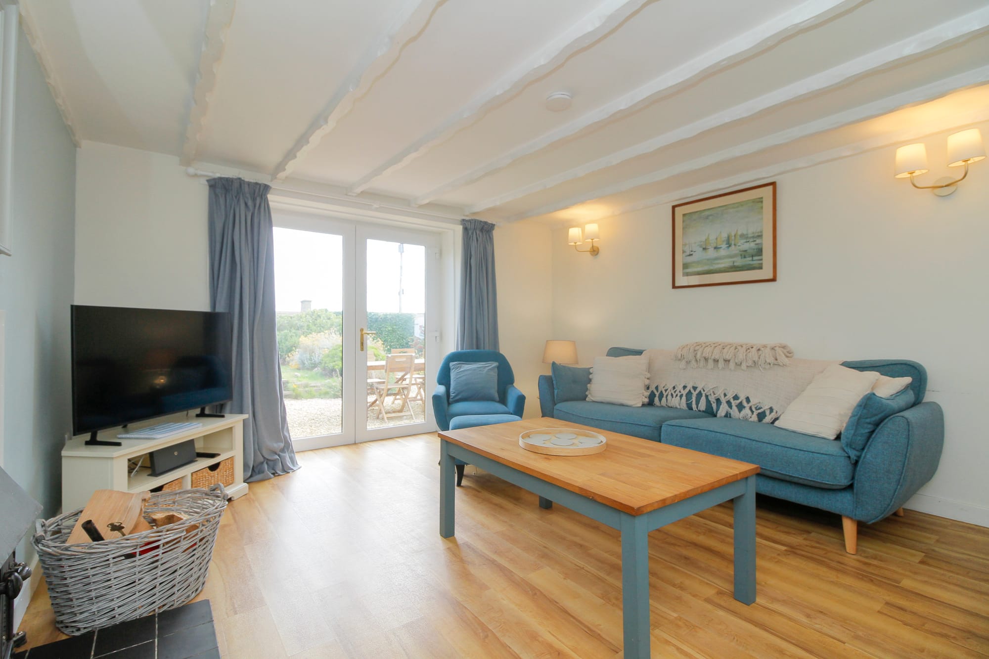 Living room looking towards the window and television — Dunbar Street, Burghead