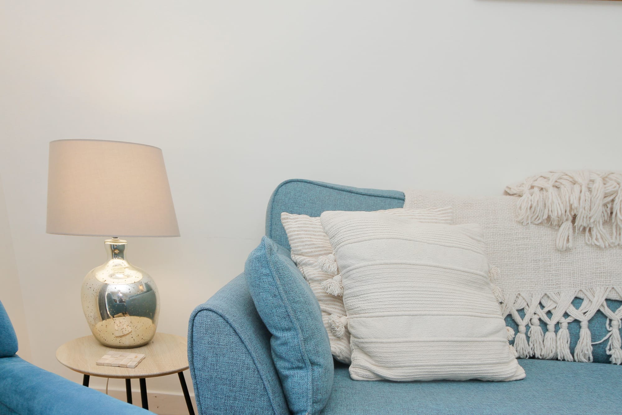 Cushions and lamp detail in the living room — Dunbar Street, Burghead