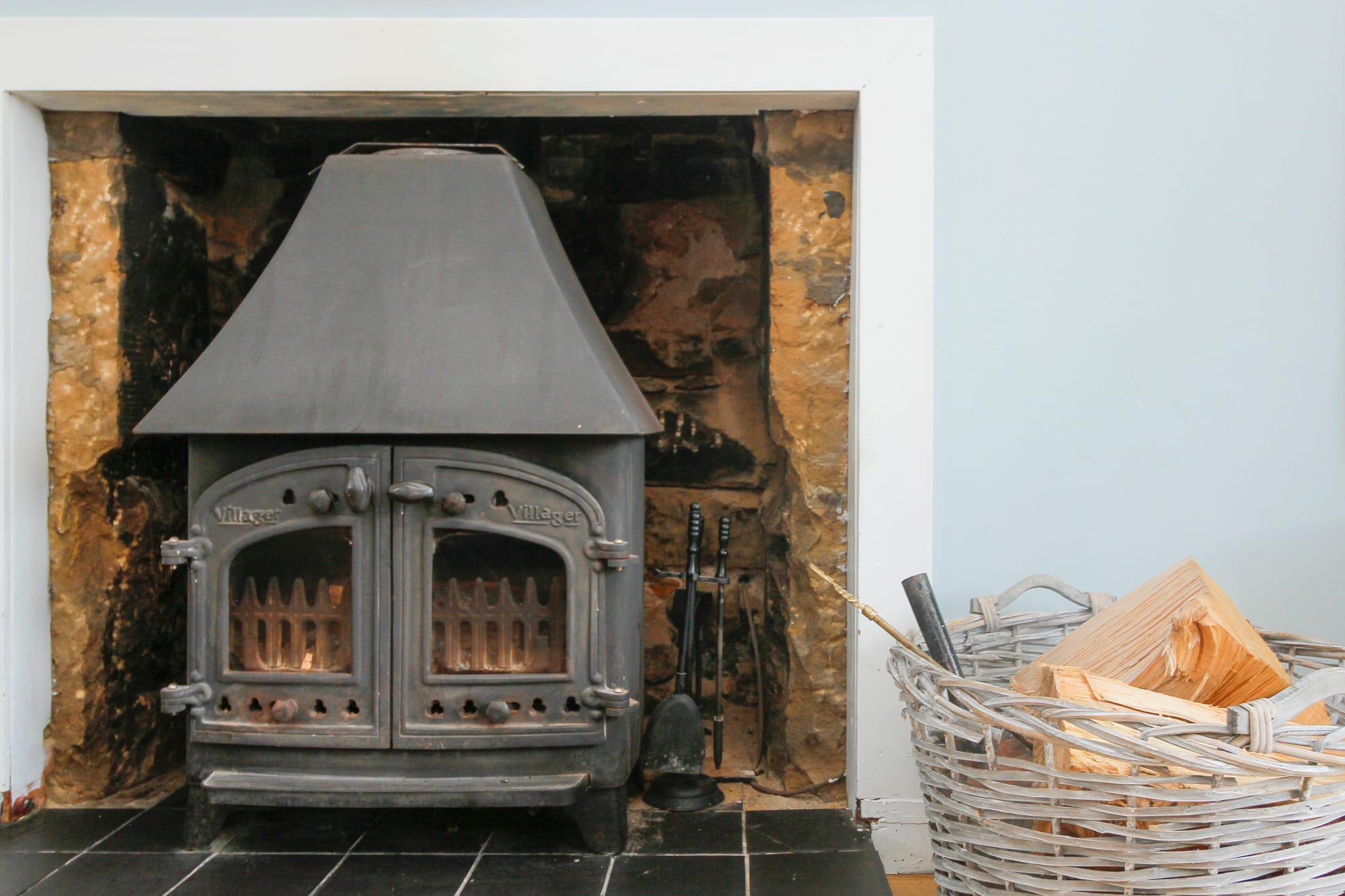 Close view of the wood-burning stove set into the original fireplace — Dunbar Street, Burghead