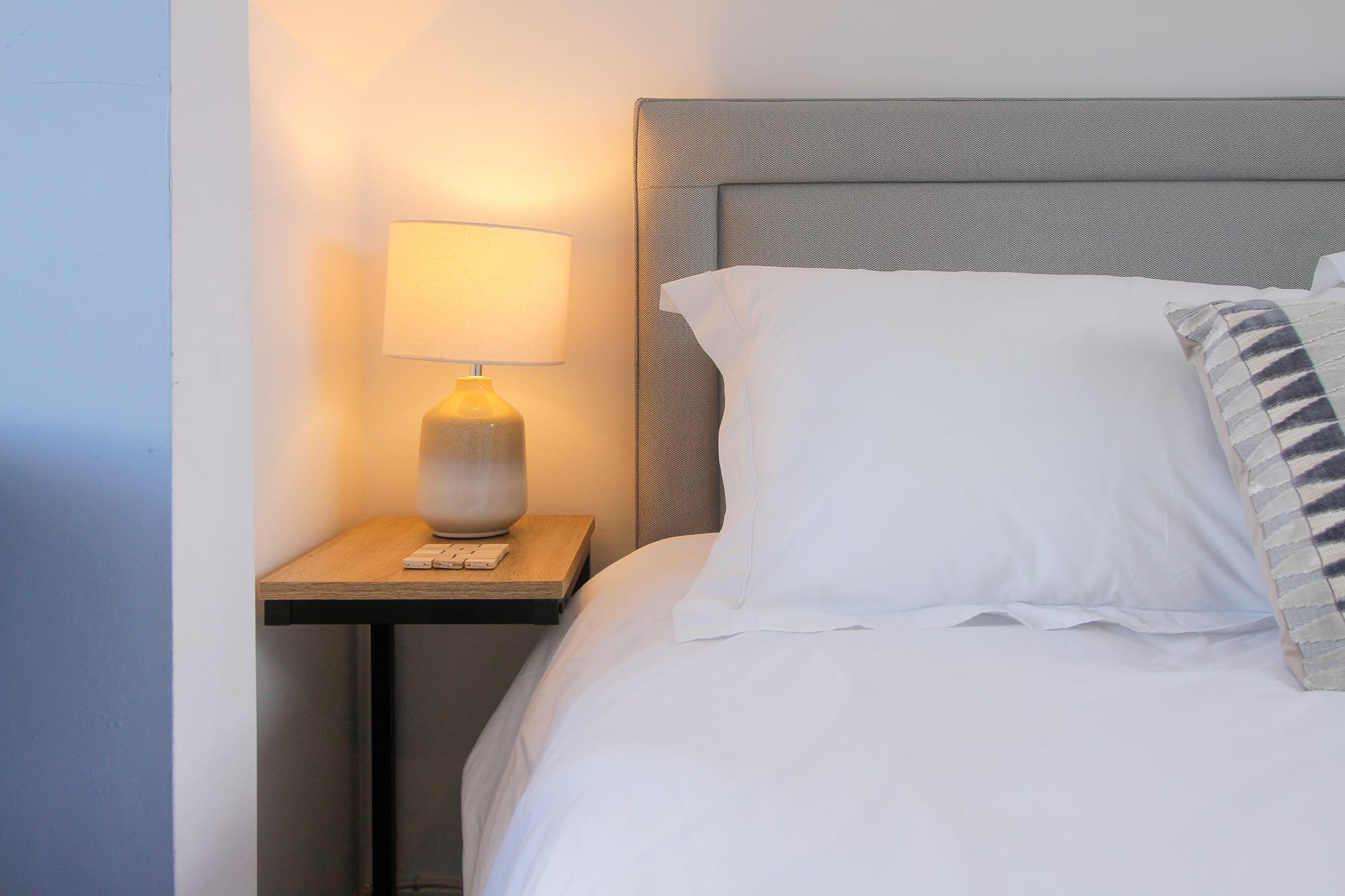 Bedside table and lamp detail — Dunbar Street, Burghead
