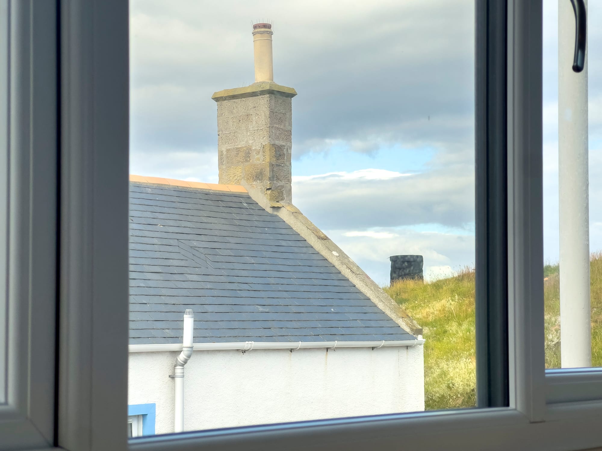 Chimneys and rooftops from an upstairs window — Dunbar Street, Burghead