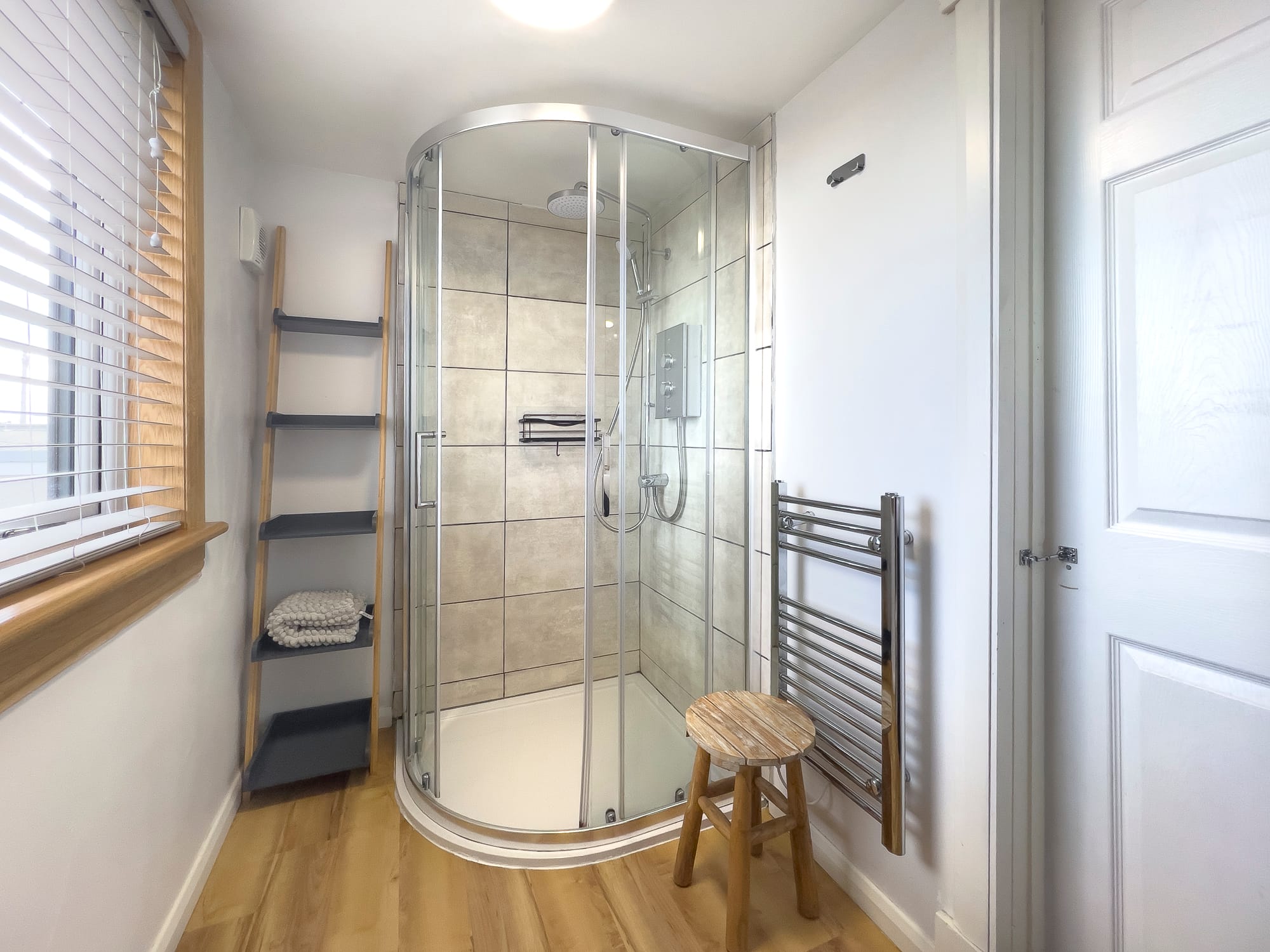 Shower room with a corner cubicle and heated towel rail — Dunbar Street, Burghead