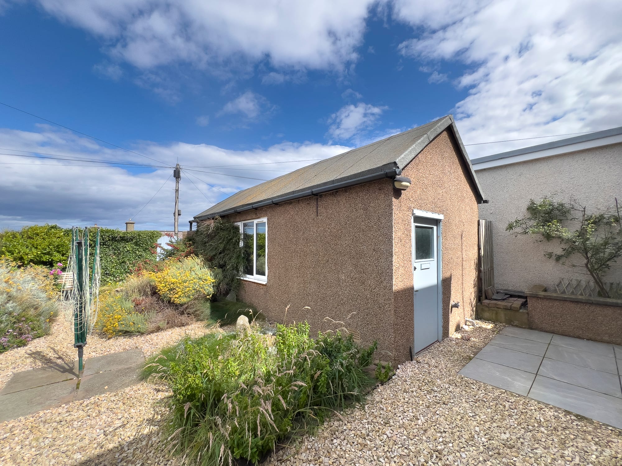 Side path and planting beside the house — Dunbar Street, Burghead