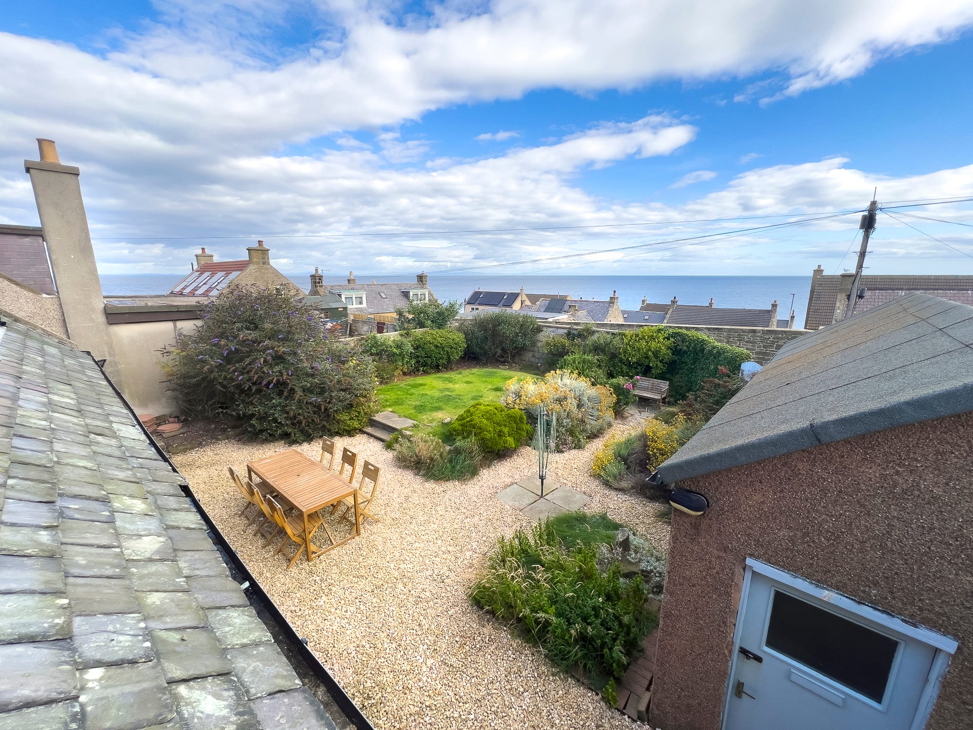 Elevated view across the garden towards the rooftops — Dunbar Street, Burghead