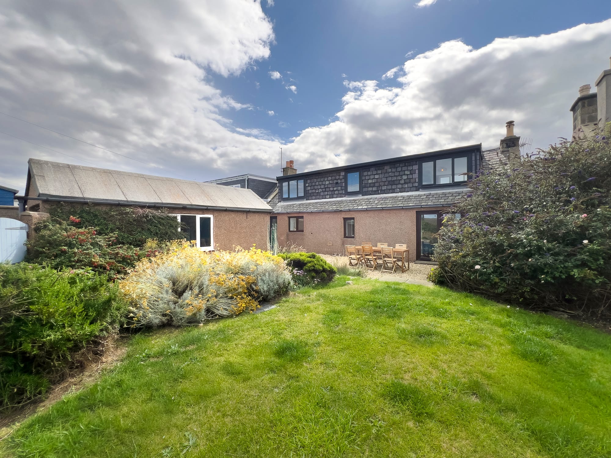 Rear elevation seen across the lawn — Dunbar Street, Burghead