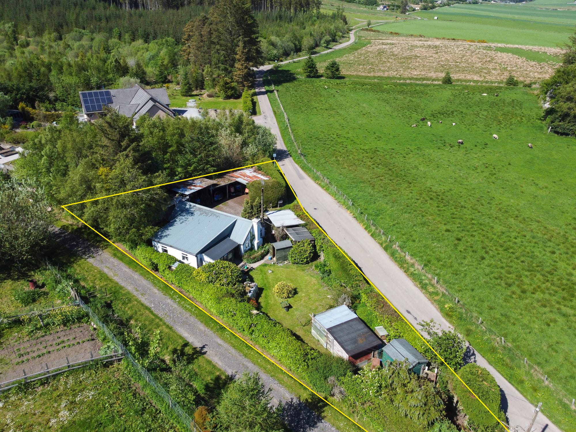 Aerial view of the cottage and grounds