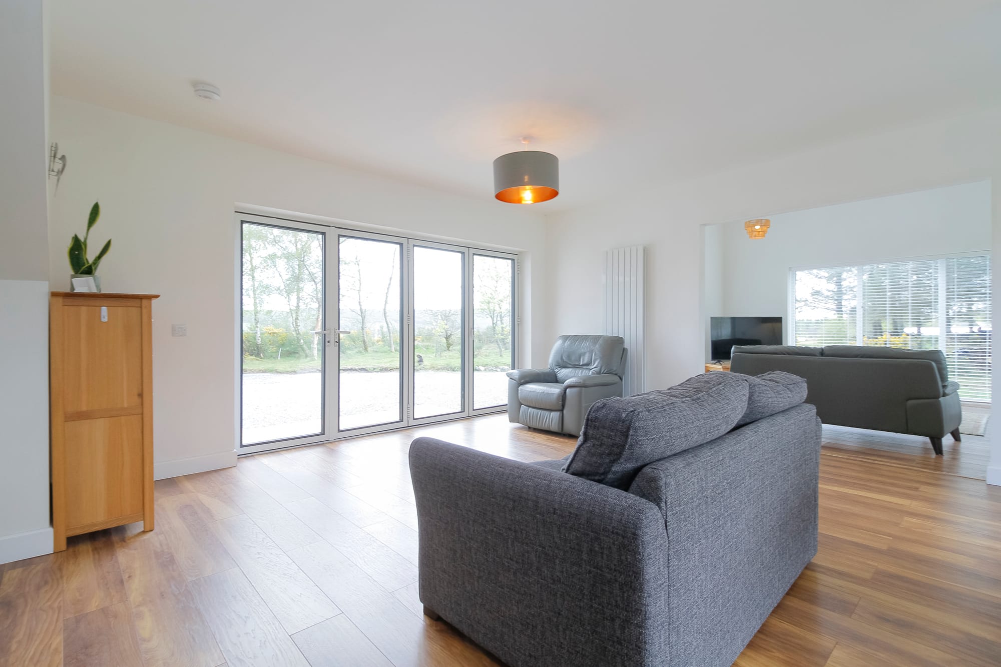 Living area with bi-fold doors to the garden