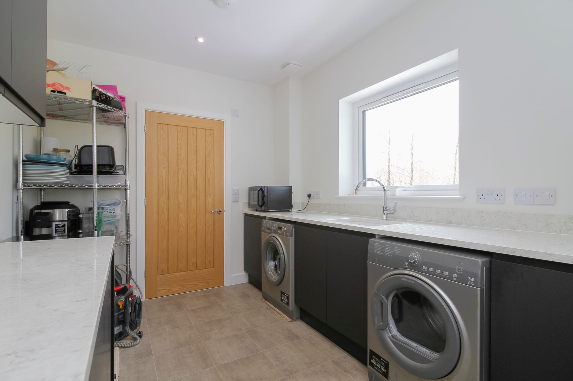 Utility room with laundry appliances