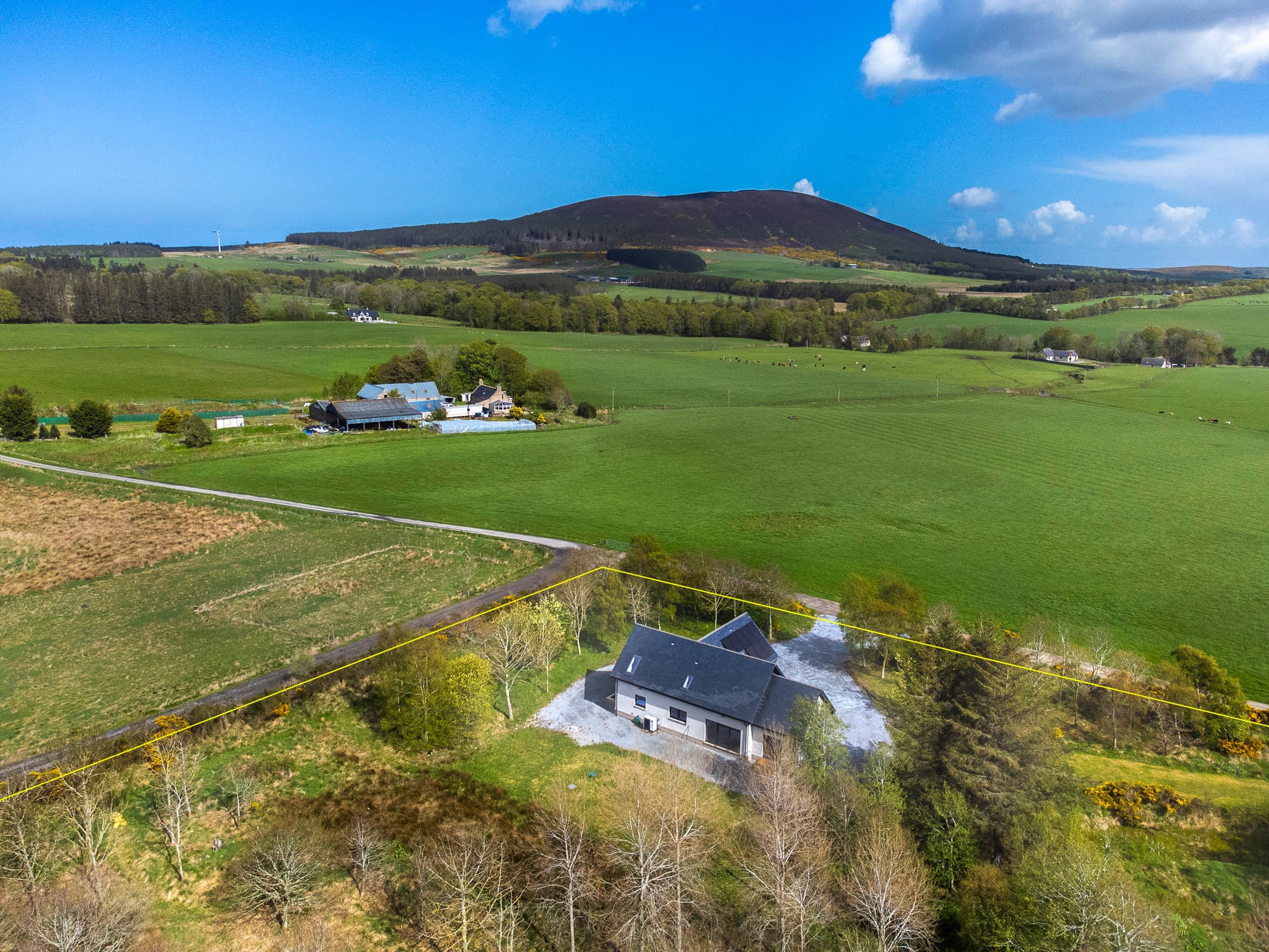 Aerial view over the property and land