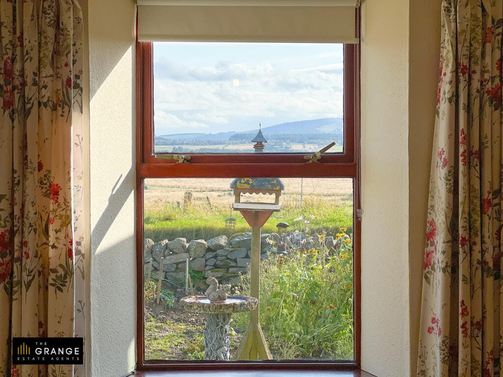 The countryside view from the bedroom window