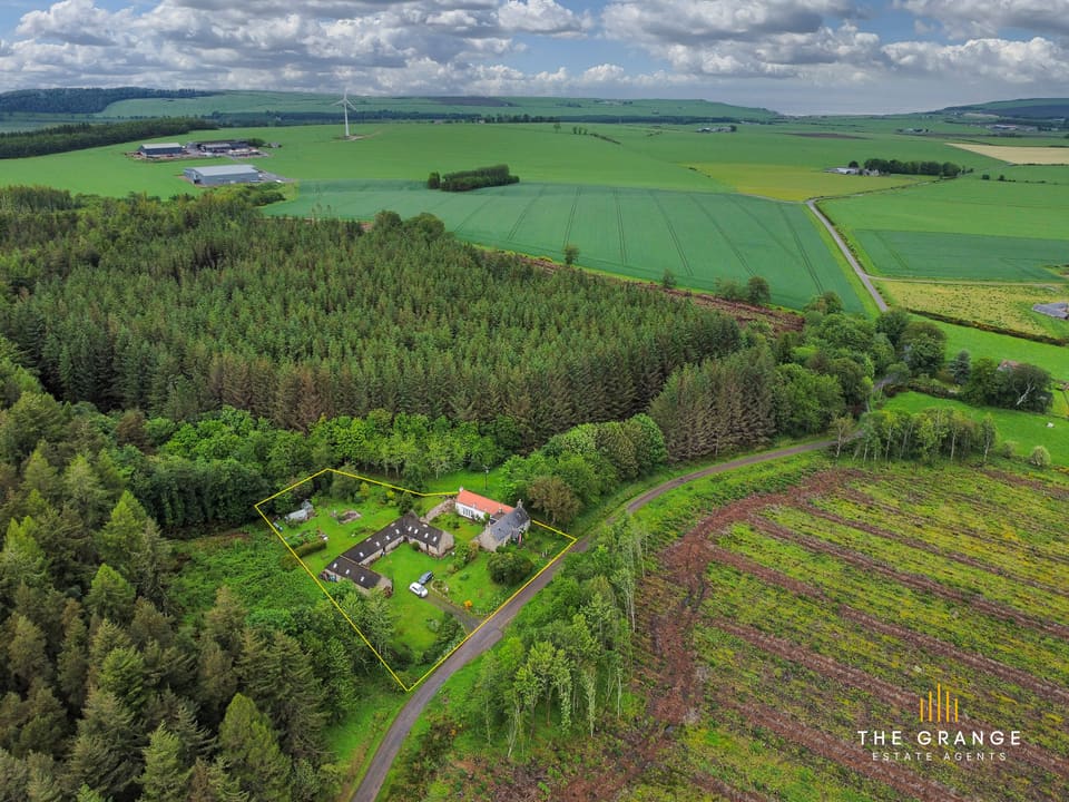 Aerial view of the property and grounds