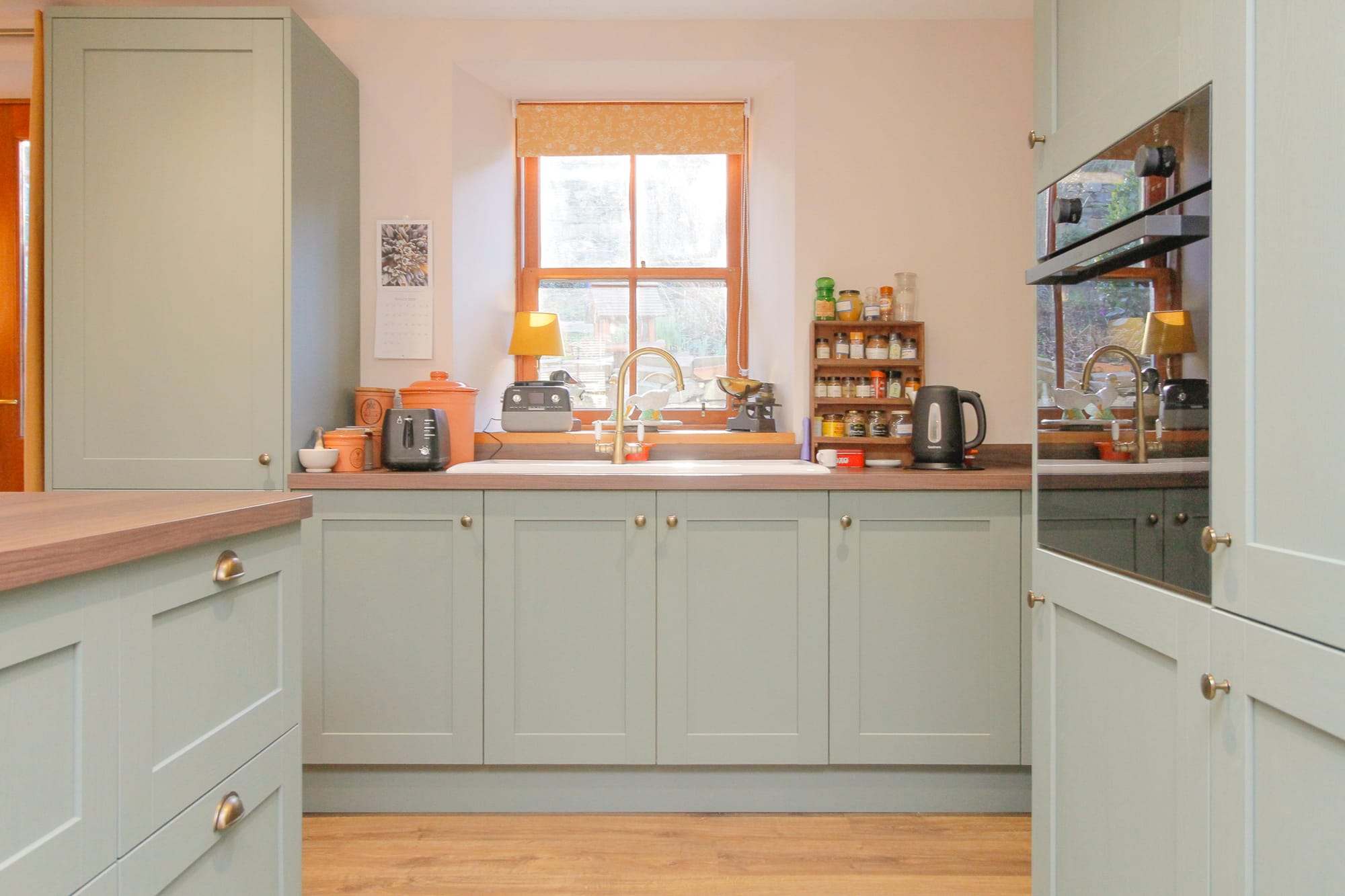 Kitchen with sage cabinetry