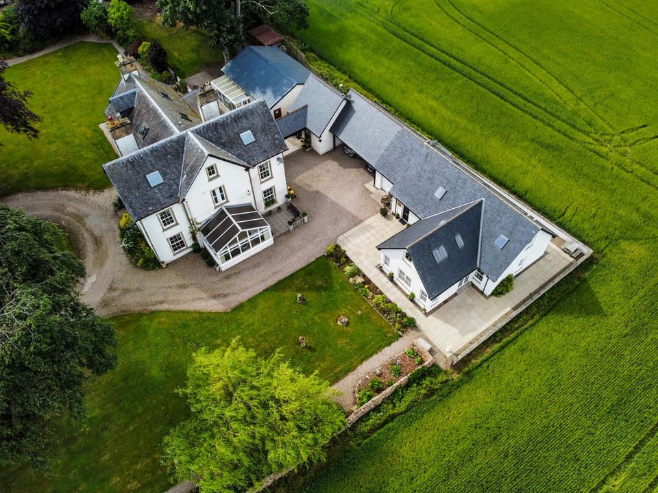 Aerial view of the property and grounds