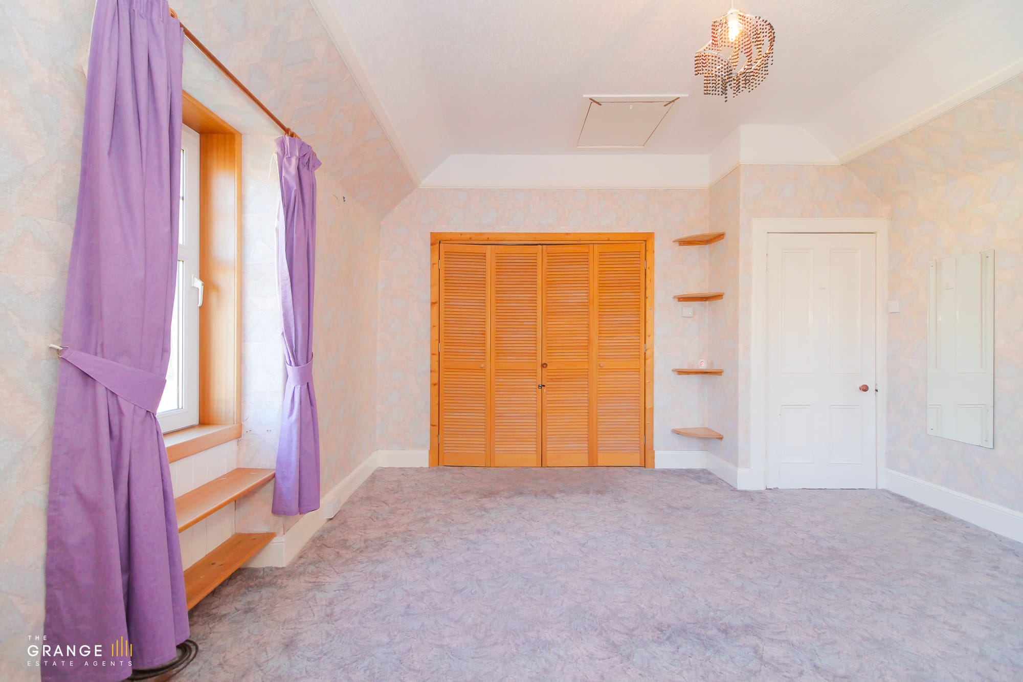 The same bedroom, with built-in window seat
