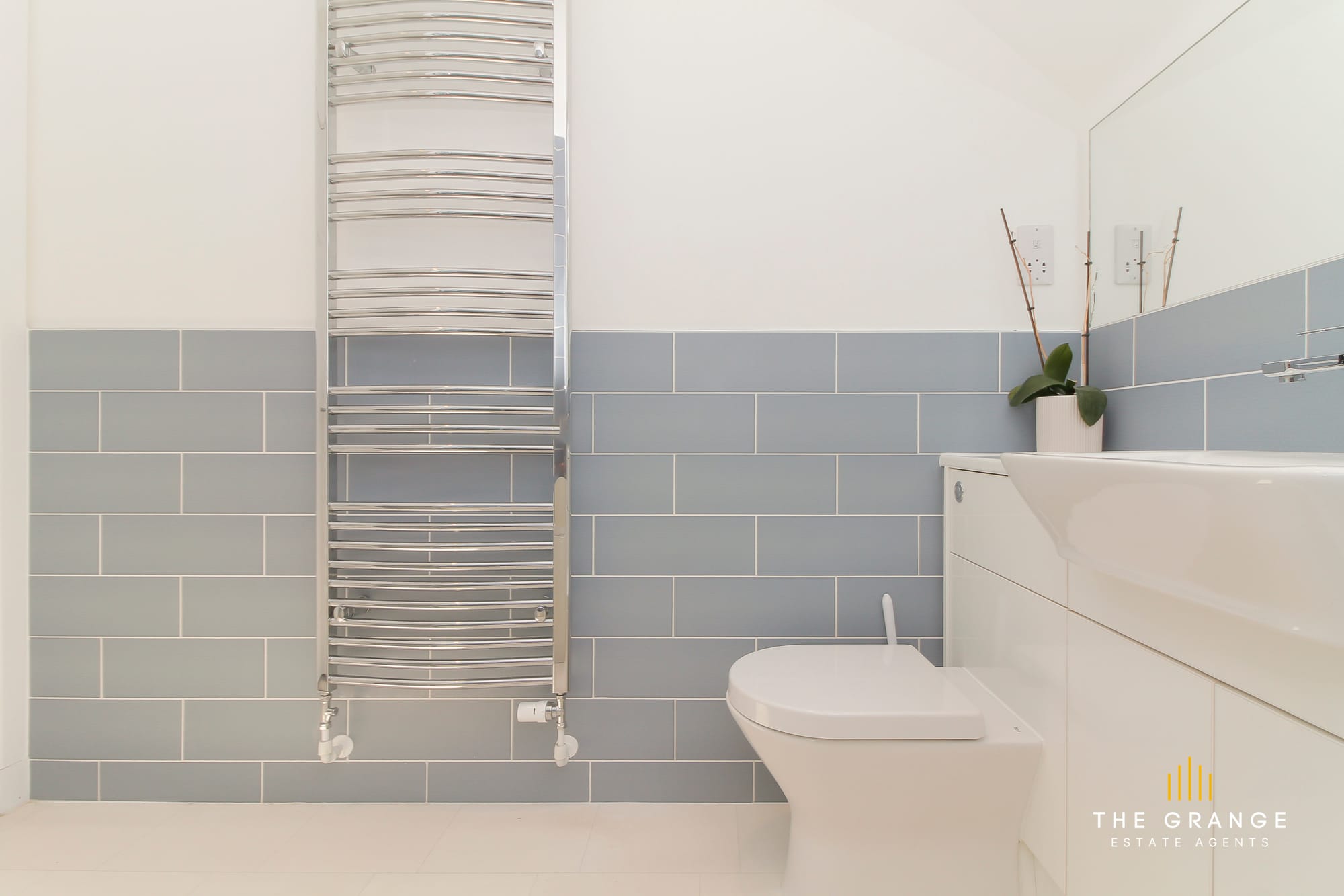 Family bathroom, towel radiator and WC