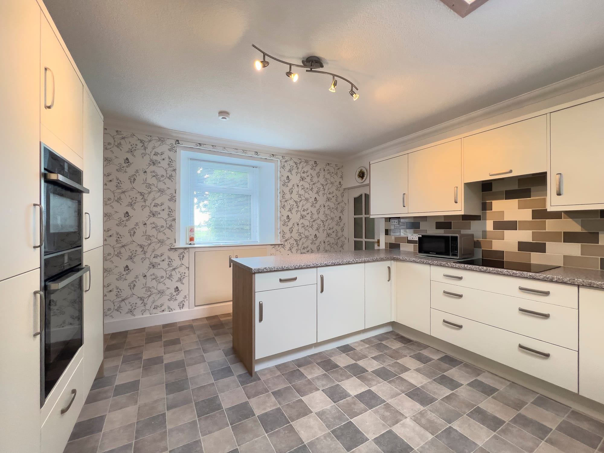 Kitchen with built-in double oven