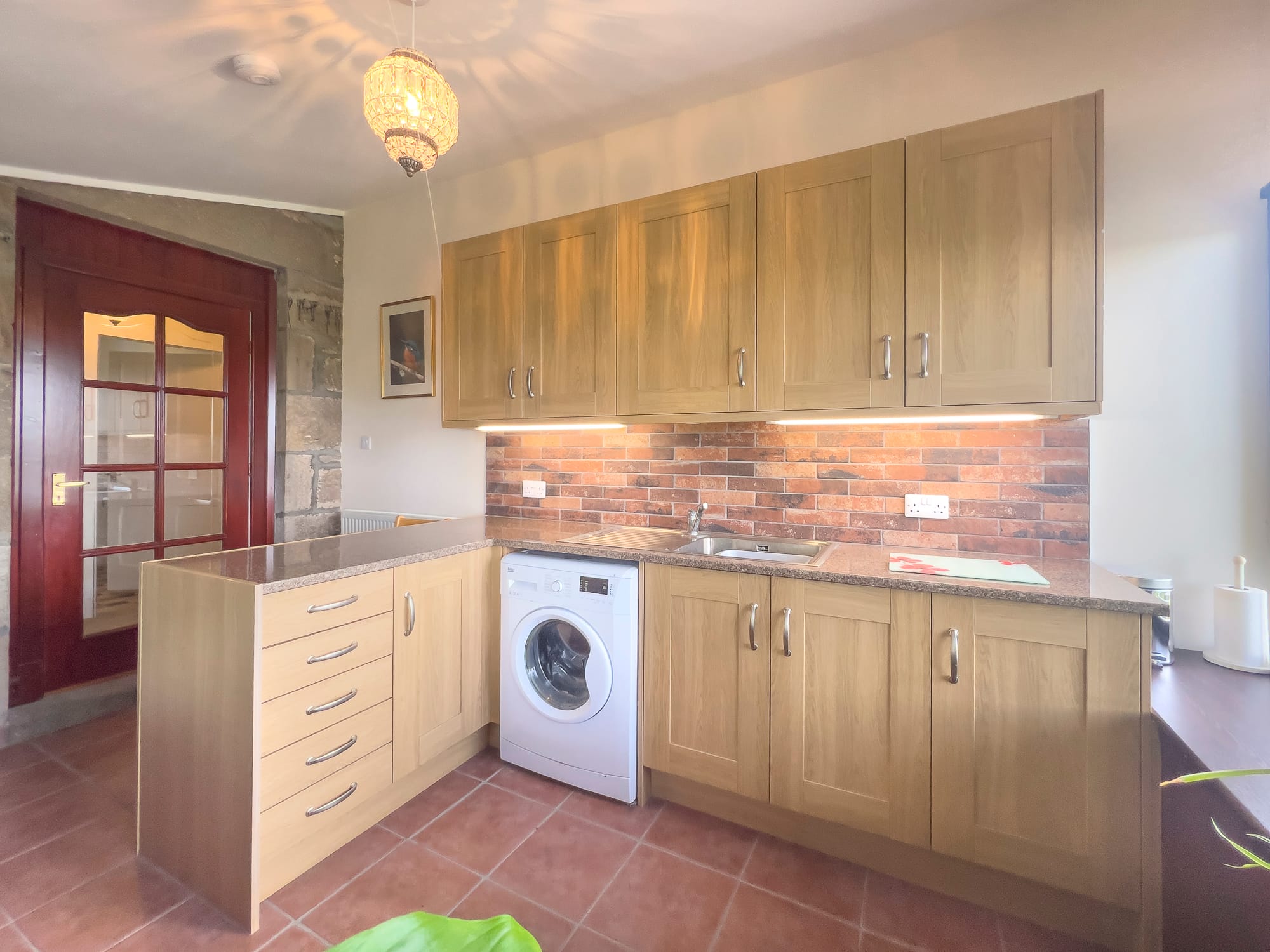 Utility room with fitted units