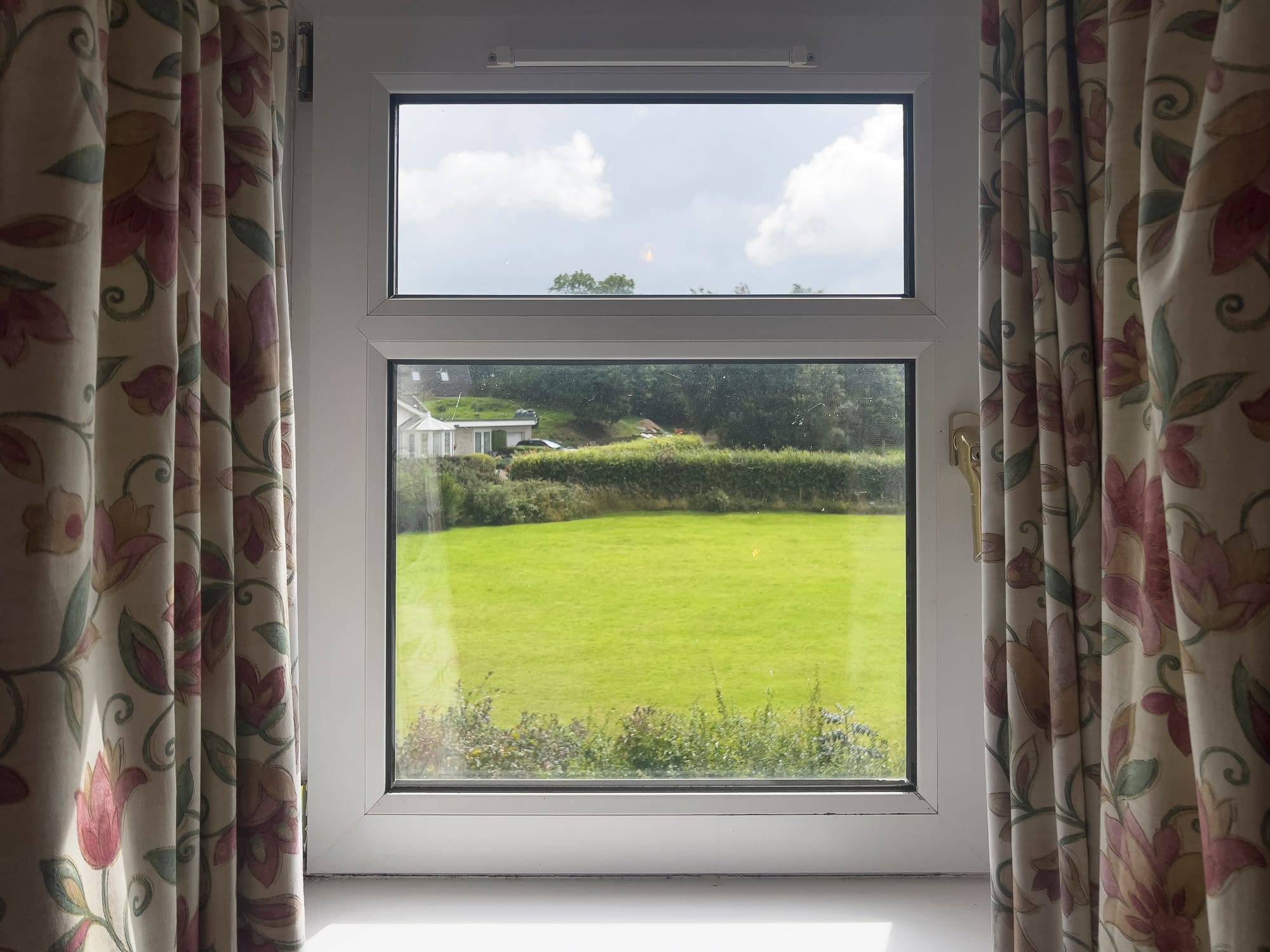 Window onto the garden and fields