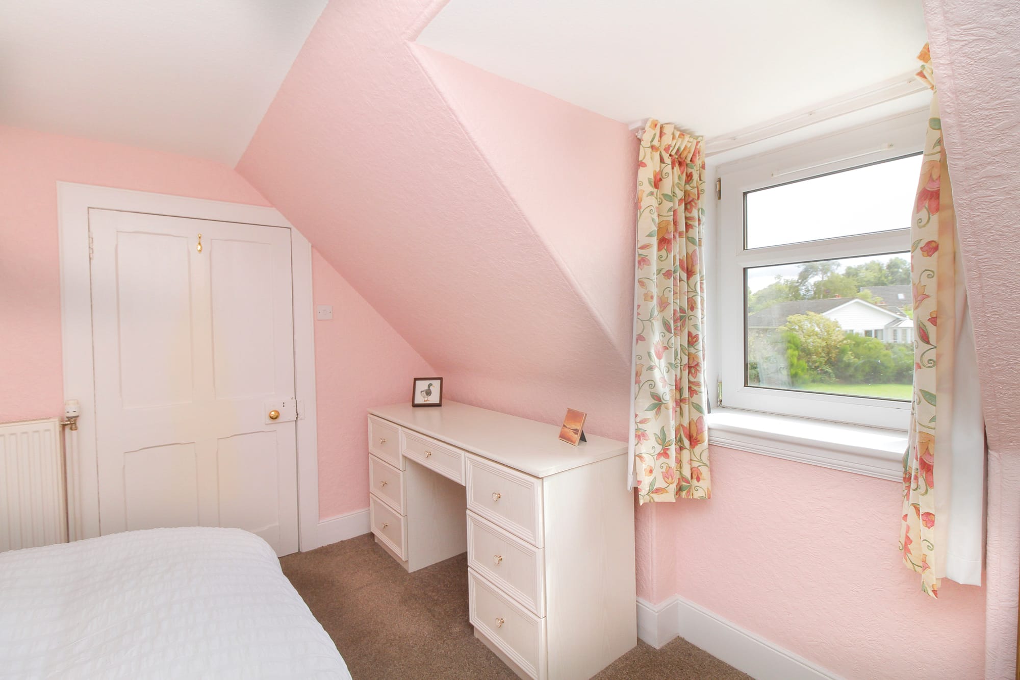 First-floor bedroom with fitted furniture