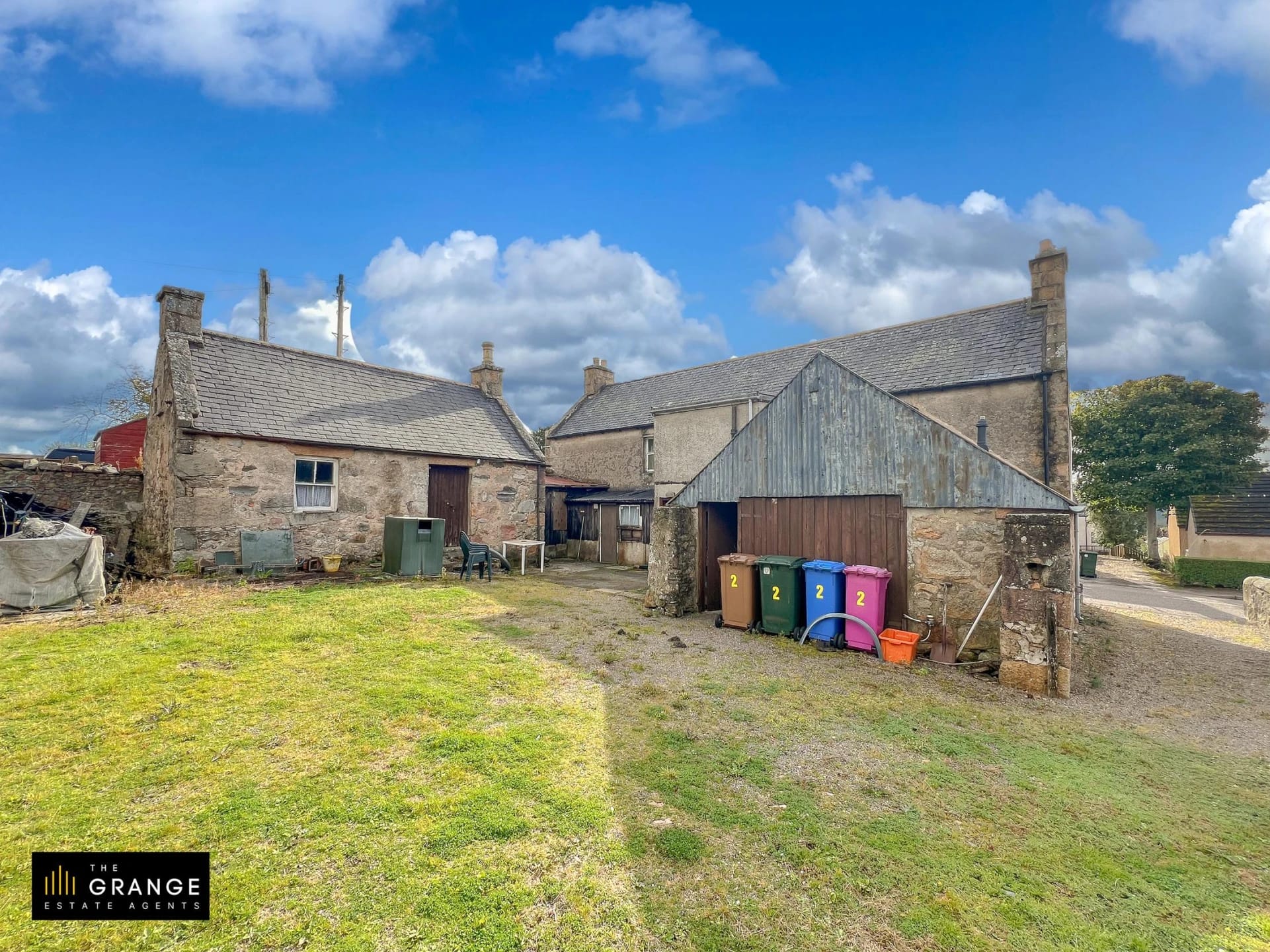 The stone outbuildings